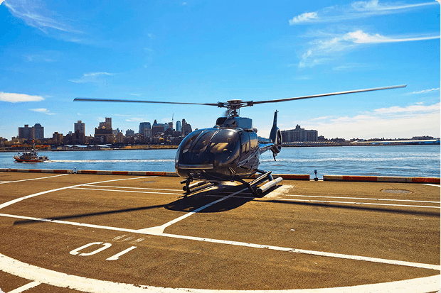 Silk Sky Air helicopter on the helipad overlooking the city skyline